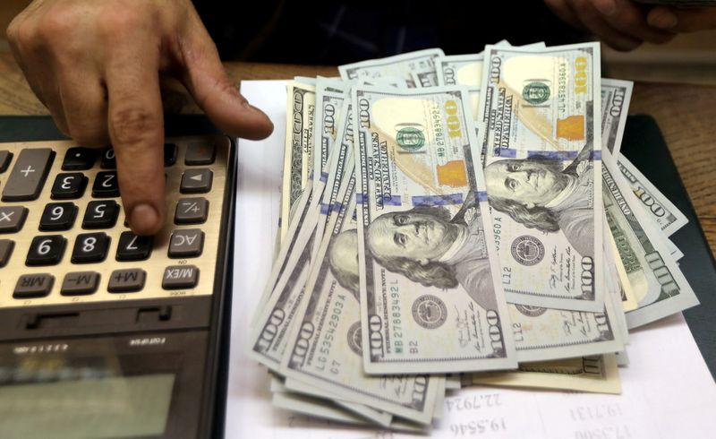 Dollar dips ahead of Fed meeting, cryptocurrencies jump