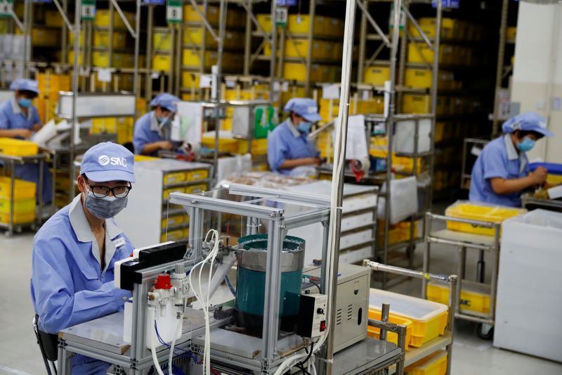 China July factory activity seen growing at a slightly slower pace: Reuters poll