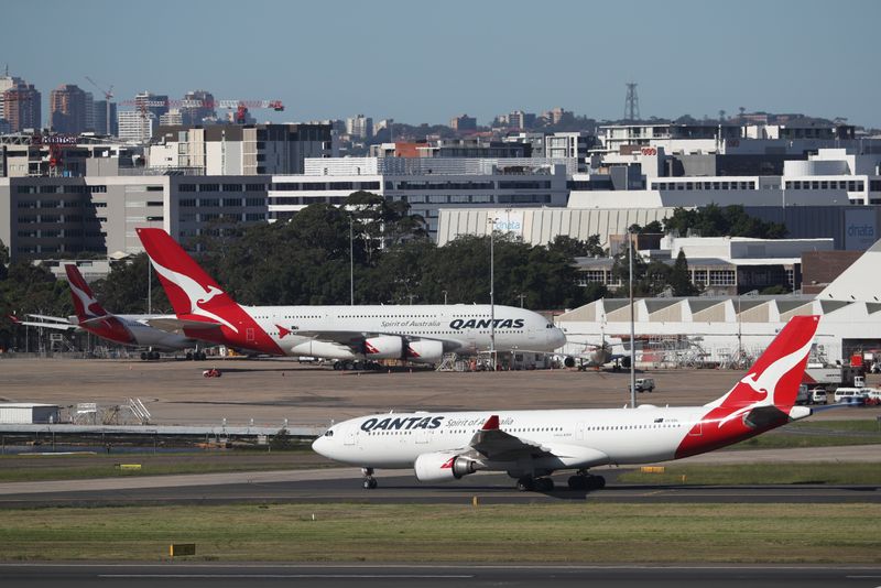 Qantas aims for international travel from December as loss narrows