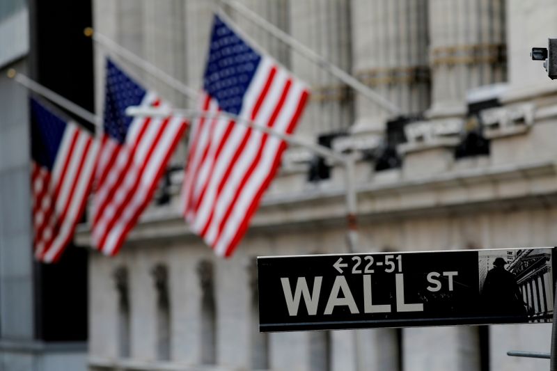 U.S. stocks close lower on worries over recovery, corporate tax hikes
