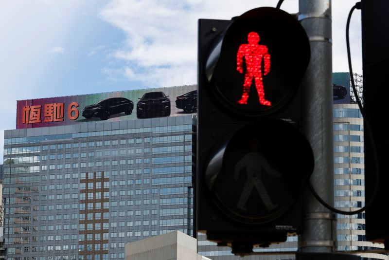 China Evergrande bond trading suspended after downgrade