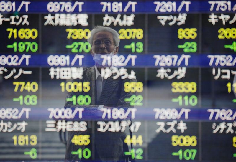 Asian stocks fall to near 1-year lows as oil rally fuels inflation fears