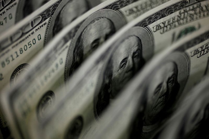 Dollar near one-year high ahead of Fed meeting minutes