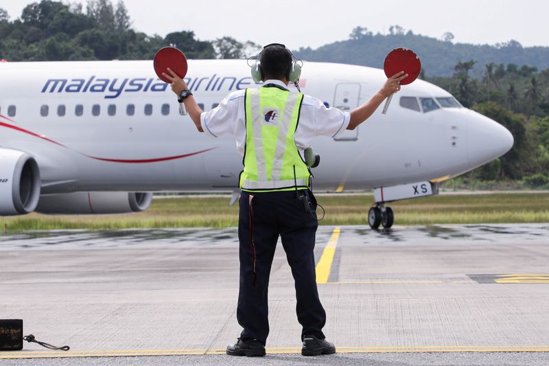 Asia's airlines ramp up flights, offers as tough COVID travel curbs ease