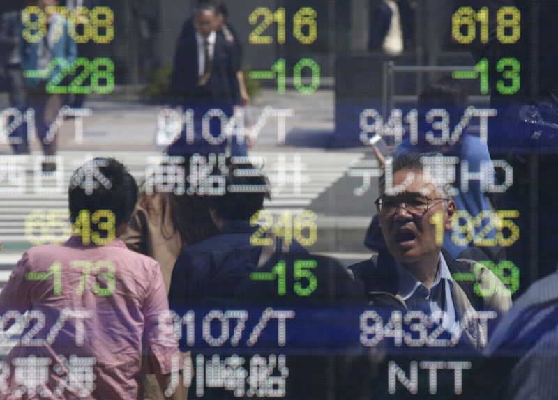 Asian shares mixed as investors await crucial Fed decision