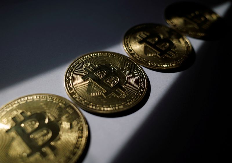 Crypto rally lifts ether to new record, bitcoin to near 3-week high