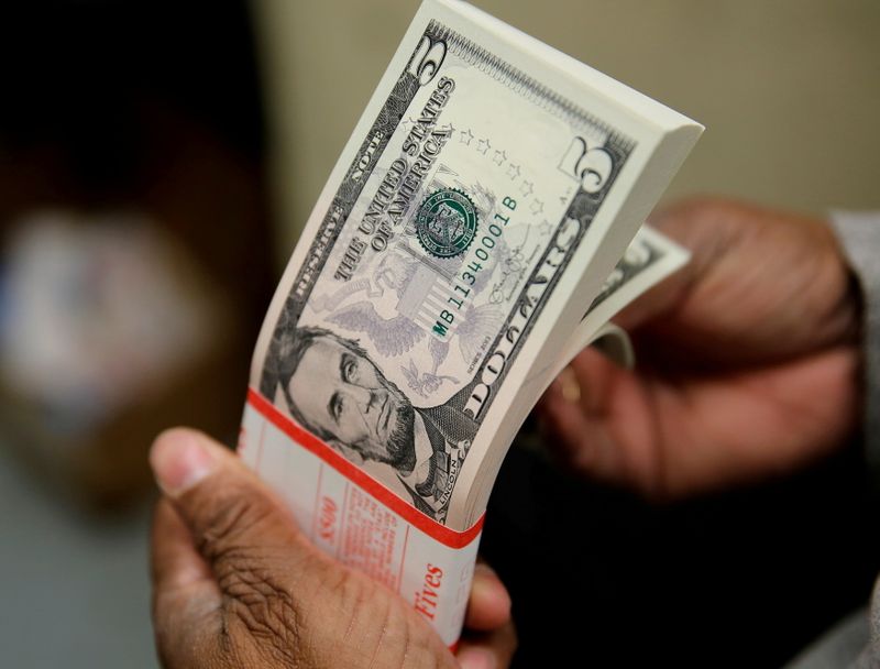 Dollar pauses for breath, hovers below 16-month top