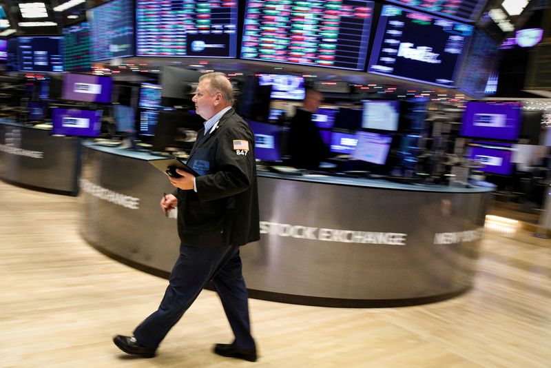 Wall Street ends down, investors eye inflation and Omicron