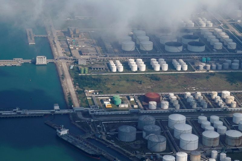 Oil falls as U.S. inventory build prompts profit-taking