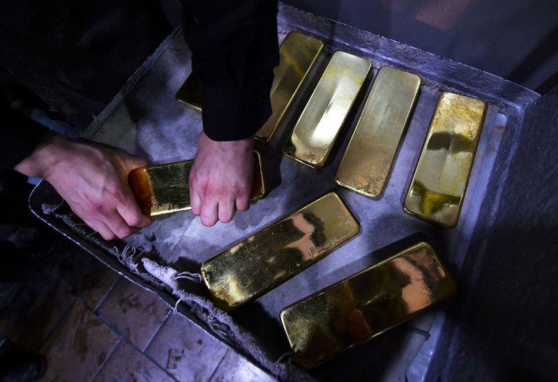 Gold rises as Ukraine crisis escalates, hawkish Fed caps gains