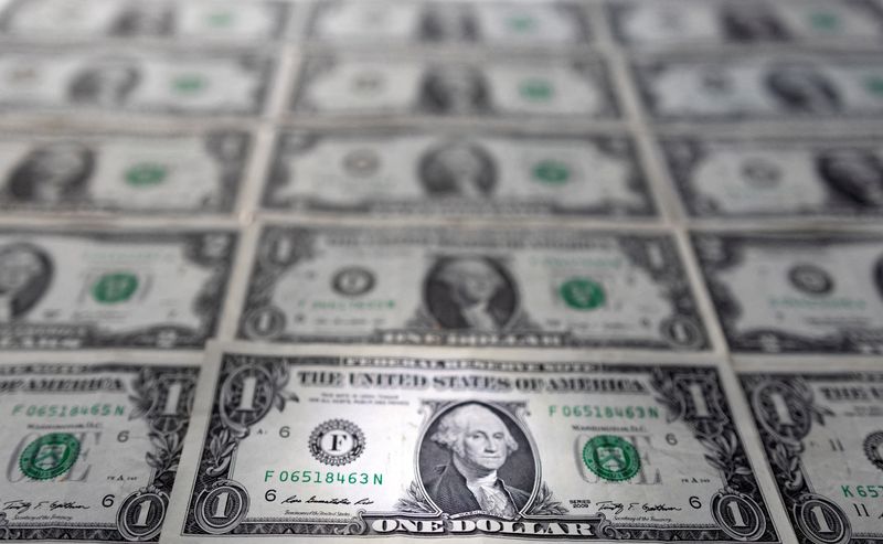 Dollar inches up to new two-year peak, set for best week in four
