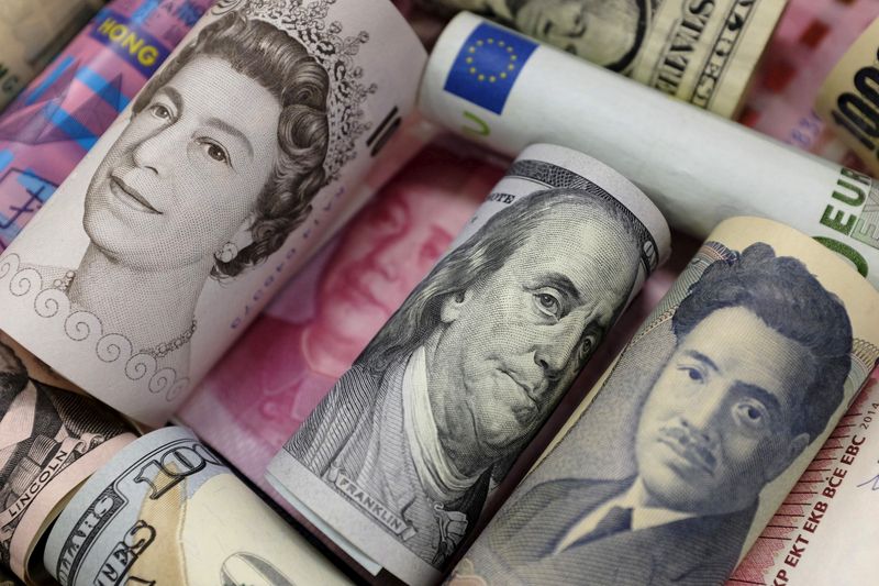 Key currency marks tumble as dollar climbs over 130 yen, euro falls past $1.05