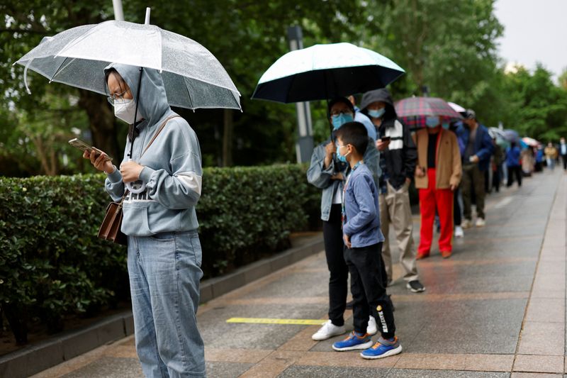 Beijing kicks off fresh round of COVID tests as Shanghai postpones crucial exams