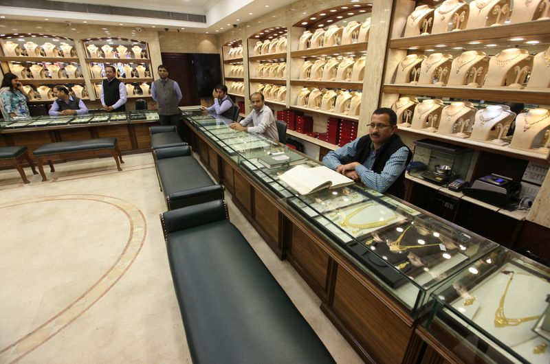 Gold slides to 3-1/2-month low as dollar strength slams demand