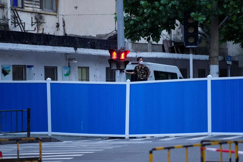Shanghai hits prized 'zero COVID' status but lockdown lingers