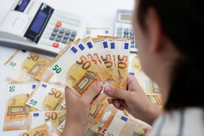 Euro edges down but set for largest monthly gain in a year
