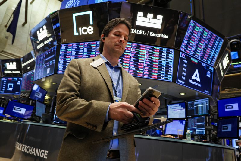 Wall Street ends lower ahead of economic data, earnings