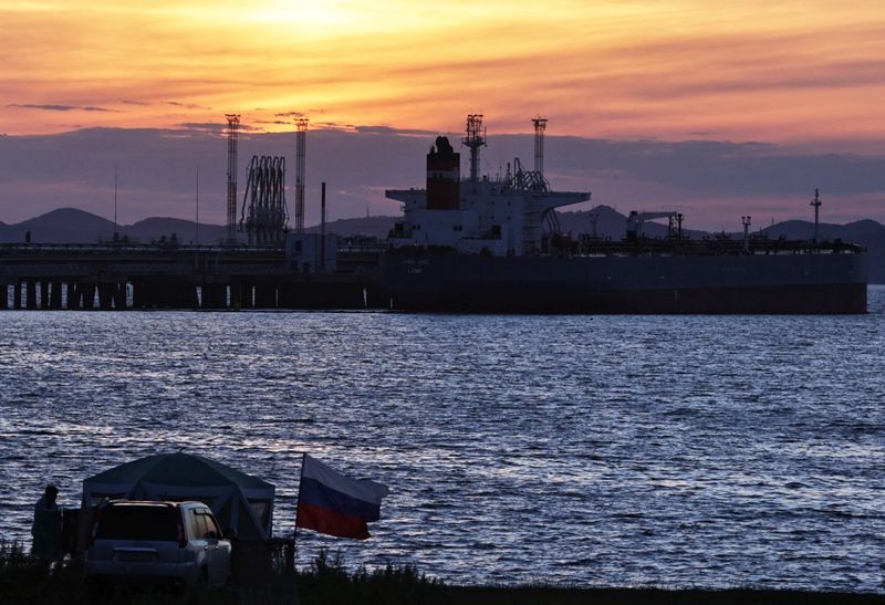 Oil holds gains on China rebound, even as U.S. crude stocks rise